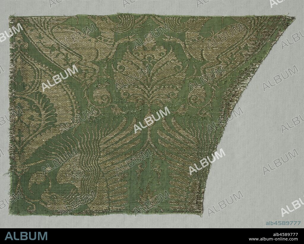Exotic Gold-patterned Silk, 1360-1400. This superb quality silk with radiant gold thread on a rich green ground ranked among the most extravagant textiles woven in Italy during the 1300s. The Italian silk designer combined primarily exotic Chinese and Islamic motifs into the exceptionally dynamic pattern in the international style. Mythical beasts with flaming manes appear amid large palmette leaves. A chasuble in this fabric has survived, hidden during World War II behind a false wall in Saint Mary?s Church in Gdansk, Poland. A remarkably similar silk provides the lavish background in the museum?s painting John the Baptist by the Flemish painter Robert Campin. The display of such luxury continues the practice of using the finest items in the worship of God.