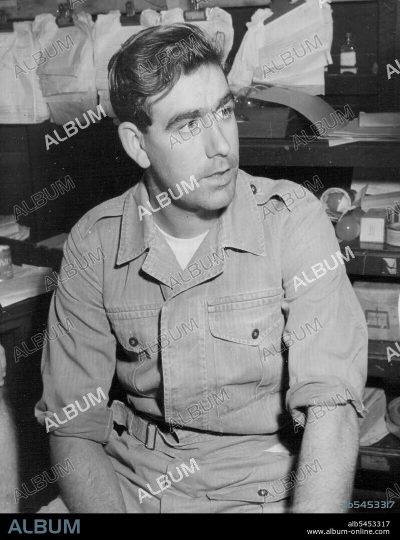 Speakman, V.C. In Singapore on Way Home - 'I Want to go Back'. - Private William Speakman, V.C. pictured at Changi Airport, Singapore, on his way home from Korea - he is expected to reach Britain early next week. He said at Changi that he would like to go back to Korea and be with 'the boys' again after his leave. Private Speakman, aged 24 and 6ft. 6 ***** 6ft. 6in. tall, is to be honours with a civic reception in his home ***** (Altrincham, Cheshire). He was awarded the second Victoria Cross of the Korean war for 'supreme' heroism and gallantry when leading grenade charges on Hill 217. January 26, 1952. (Photo by Reuter Photo).