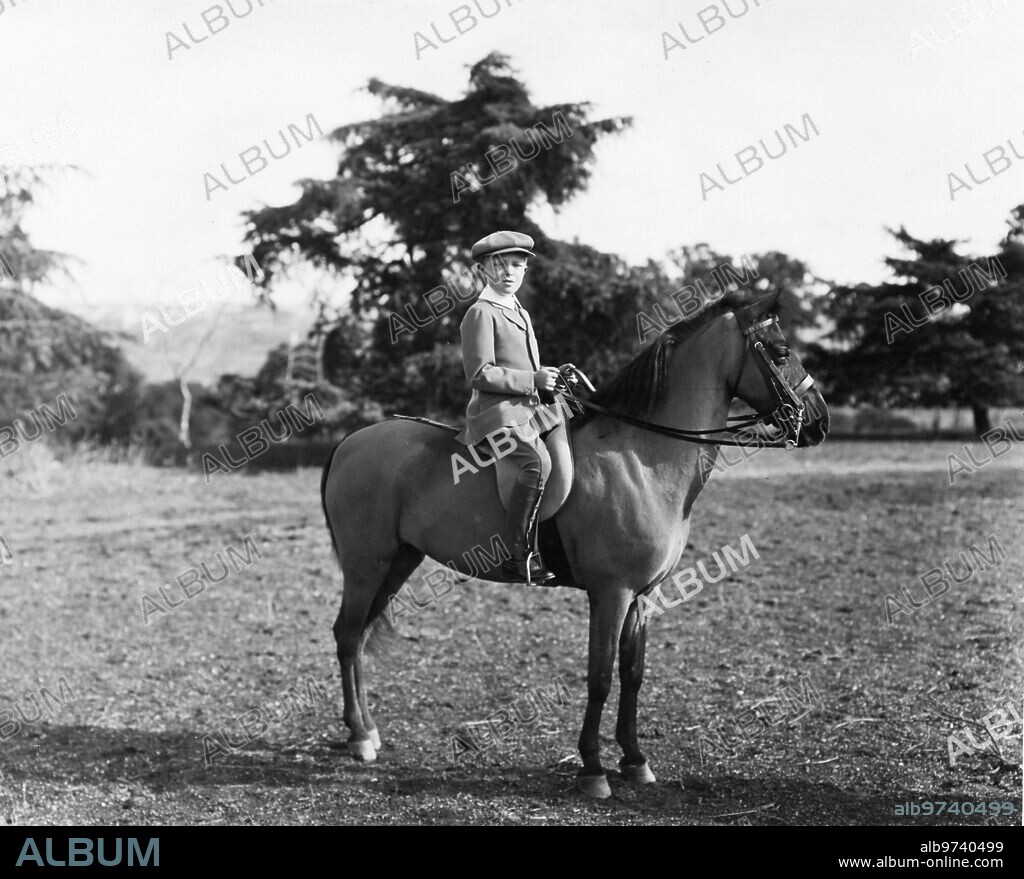 February 1916. The heir to the throne of Spain. HRH the Prince of Asturias Walking on horseback through the country house.