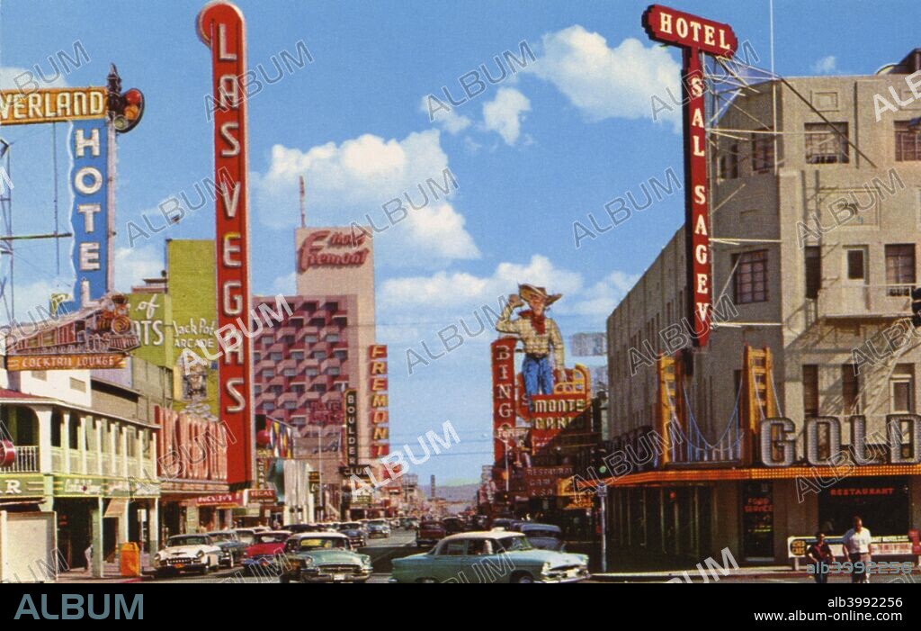 Fremont Street From Main Street, Las Vegas, Nevada, USA, 1956. Vintage postcard showing the various clubs, casinos and hotels on Fremont Street, including the Overland Hotel, Las Vegas Club and the Sal Sagev Hotel. The 'Howdy Podner' sign on the Pioneer Club is visible in the background. The cowboy figure was popularly known as 'Vegas Vic'.