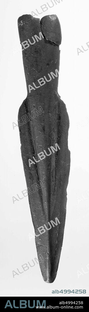 Bronze spear point with two holes through the shaft neck for a locking pin. Damaged along the edge of the neck: the shaft neck is torn in., spear point, metal, bronze, 16.5 x 3.2 cm, prehistory -1600.