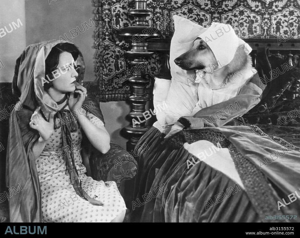 Hollywood, California:  c. 1927 The story of 'Little Red Riding Hood' portrayed by Dorothy Sebastian and 'Flash', the dog star of the movies.