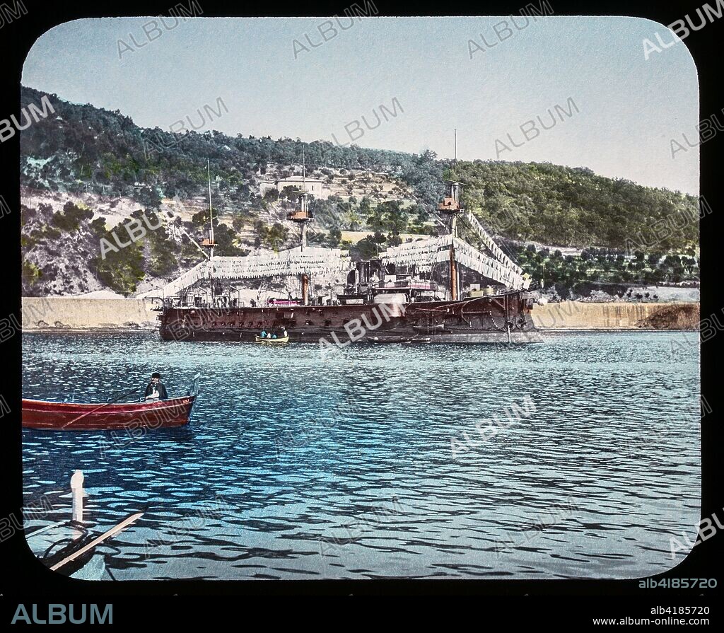 Magic Lantern slide circa 1900. Victorian or Edwardian era. The origional monchrome ( black and white ) photograph hand coloured.The photograph is the work of G.W. Wilson photographer and slide manufacturer 1823-1893.George Washington Wilson (7 February 1823 - 9 March 1893)  was a pioneering Scottish photographer. The French Riviera and Monte Carlo (lecture ) . SLide 34 French Warchip Bayard Villefranche. The French ironclad Bayard was an early stationary battleship of the French Navy, lead ship of her class. Bayard had a wooden hull and a full rigging, as well as a side armour and steam machinery.,.