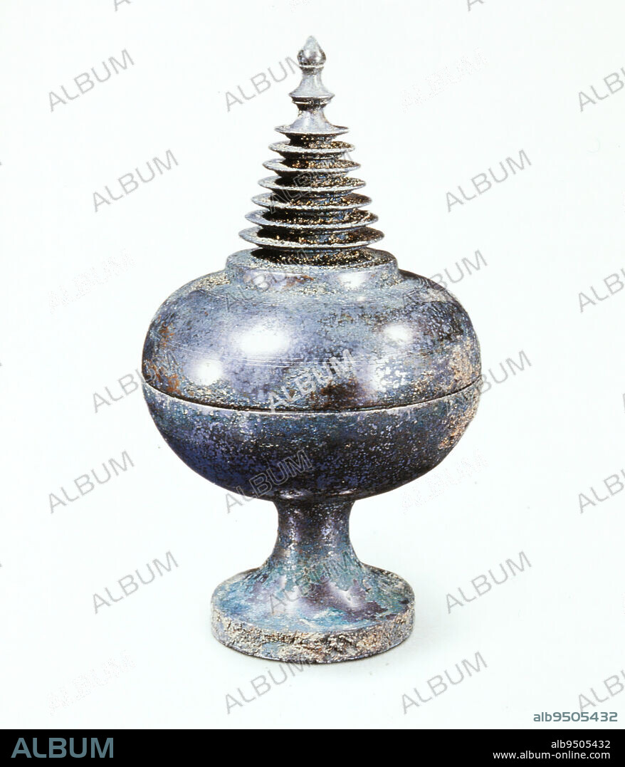 Buddhist Reliquary, 7th-8th century, 7 7/8 x 4 1/2 in. (20 x 11.43 cm), Bronze, China, 7th-8th century, Stupa-form reliquaries were used during the Tang dynasty by priests performing ceremonial worship. Ancient paintings show vessels like this placed on altars in front of Buddha images. Such containers usually held relics of a Buddhist saint (Sarira), or small precious objects that represented these persons.