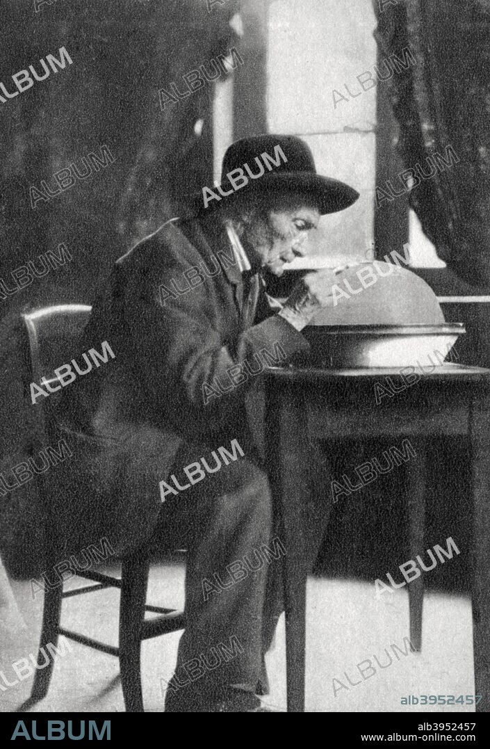 Jean Henri Fabre, French entomologist, 1880. Fabre (1823-1915) examining specimens through a magnifying glass. He wrote numerous books on the anatomy and behaviour of insects. A photograph from Album de Photographies dans L'Intimite de Personnages Illustres, 1865-1905, 4th album, Editions MD, Paris.