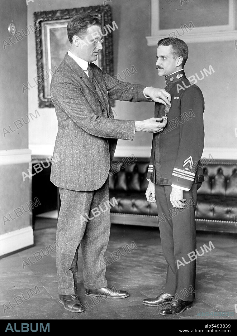 Franklin D. Roosevelt, standing, presenting an award ca. 1916-1919.