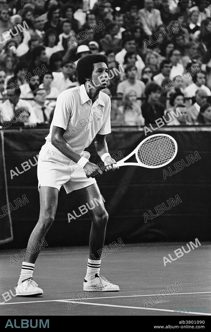 Ashe, photographed during the U.S. Pro Tennis Championships in Brookline, MA; undated. Arthur Robert Ashe, Jr. (July 10, 1943 - February 6, 1993) was an American World No. 1 professional tennis player. He won three Grand Slam titles, ranking him among the best tennis players from the United States. Ashe, an African-American, was the first black player selected to the United States Davis Cup team and the only black man ever to win the singles title at Wimbledon, the US Open, or the Australian Open. He retired in 1980. In the early 1980s, he is believed to have contracted HIV from a blood transfusion he received during heart bypass surgery. Ashe publicly announced his illness in April 1992 and began working to educate others about HIV and AIDS. He founded the Arthur Ashe Foundation for the Defeat of AIDS and the Arthur Ashe Institute for Urban Health before his death from AIDS-related pneumonia in 1993 at the age of 49.