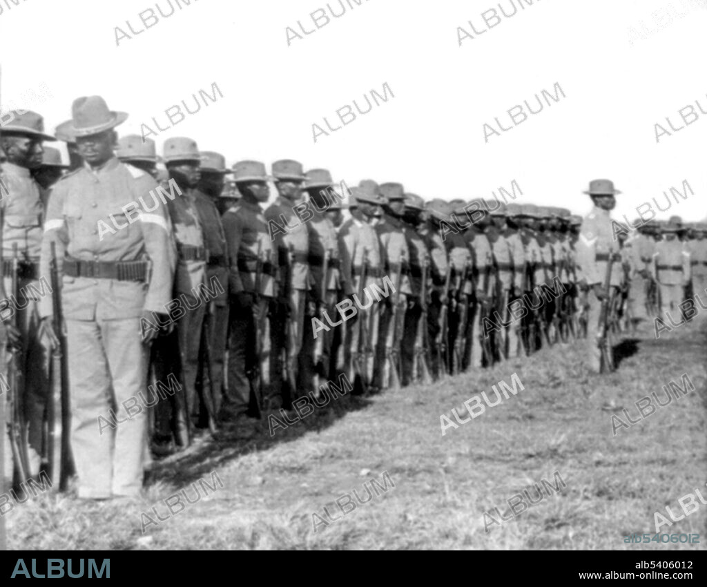The 24th U.S. Infantry at drill, Camp Walker, Philippine Islands. Buffalo Soldiers originally were members of the US 10th Cavalry Regiment of the US Army. This nickname was given to the "Negro Cavalry" by the Native American tribes they fought in the Indian Wars. The term became synonymous with all of the African American regiments formed in 1866: 9th Cavalry Regiment, 10th Cavalry Regiment, 24th Infantry Regiment, and 25th Infantry Regiment. The Philippine-American War (1899-1902) was an armed conflict between the US and Philippine revolutionaries. The war was a continuation of the Philippine struggle for independence that began in 1896 with the Philippine Revolution. Cropped stereograph, C.H. Graves, 1902.