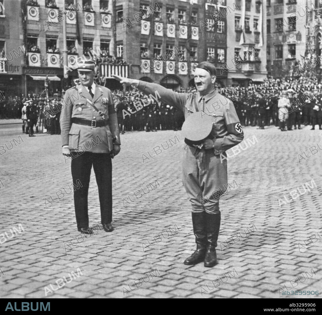 Adolf Hitler greets the enthusiastic crowd at the 1936 Nuremberg Rally of Honour.