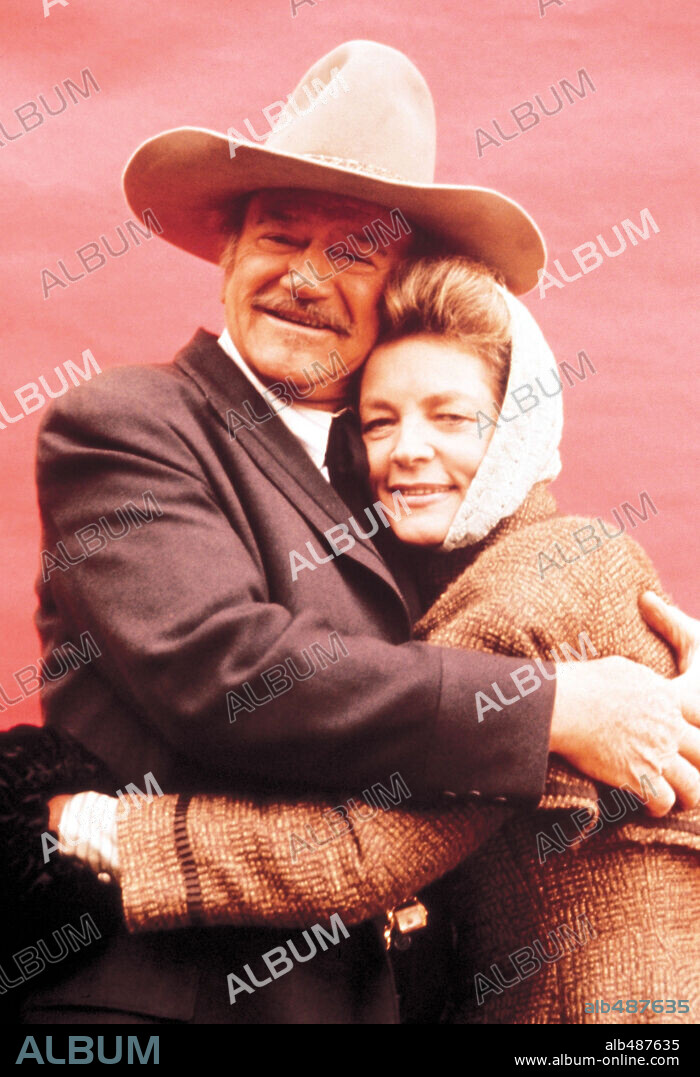JOHN WAYNE and LAUREN BACALL in THE SHOOTIST, 1976, directed by DON SIEGEL. Copyright PARAMOUNT PICTURES.