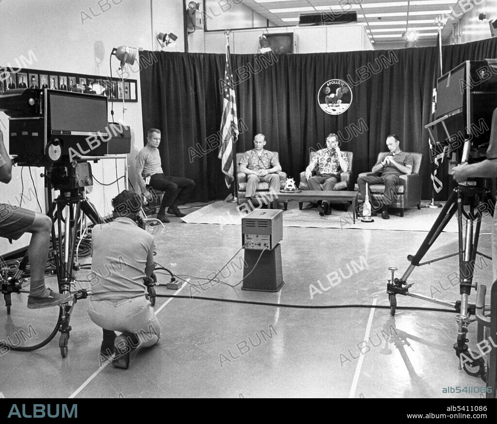 Apollo 11 crew members (R-L) Michael Collins, Neil Armstrong, and Edwin Aldrin, participated in a closed circuit press conference the night before they began their historic lunar landing mission. At far left is chief astronaut and director of flight crew operations, Donald K. Slayton. The press conference with questions via intercom, was held under semi-isolation conditions to avoid exposing the astronauts to possible illness at the last minute. Apollo 11 was the spaceflight that landed the first two people on the Moon. Commander Neil Armstrong and lunar module pilot Buzz Aldrin landed the Apollo Lunar Module Eagle on July 20, 1969. Armstrong became the first person to step onto the lunar surface six hours later on July 21; Aldrin joined him 19 minutes later. They spent about two hours together outside the spacecraft, and collected 47.5 pounds of lunar material to bring back to Earth. Command module pilot Michael Collins flew the command module Columbia alone in lunar orbit while they were on the Moon's surface. Armstrong and Aldrin spent 21.5 hours on the lunar surface before rejoining Columbia in lunar orbit.