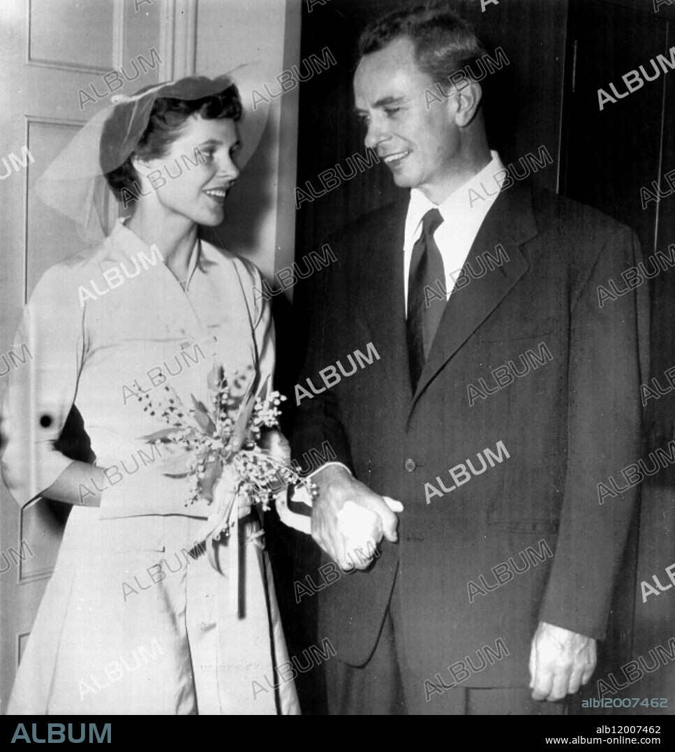 Dr Peter Lindstrom (right), former husband of actress Ingrid Bergman, leaves the Church of the Redeemer in Pittsburgh, with the Pittsburgh physician he married. The 47-year-old brain specialist is shown with Dr Agnes Rovnanek, a resident physician at Pittsburgh's Children's Hospital in a ceremony performed by Episcopal Bishop Austin Purdue. Pia Lindstrom, daughter of Lindstrom and Miss Bergman, and four close friends of the Dr and his bride, were the only witnesses at the brief ceremony. 9 September 1954.
