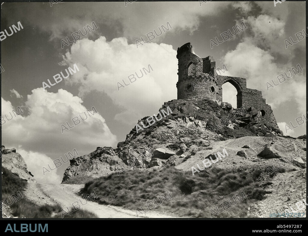 J DIXON SCOTT. Mow Cop Castle, Mow Cop, Odd Rode, Cheshire, 1920-1935. Mow Cop Castle viewed from the north-west. The 'castle' was built as a folly by Randle Wilbraham in 1754. In the late 18th century the Wilbrahams used it as a summer house. It marks the boundary between Cheshire and Staffordshire.