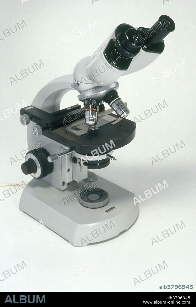 Microscope with a binocular eyepiece. A Zeiss Standard 14 research grade microscope and built in illuminator.