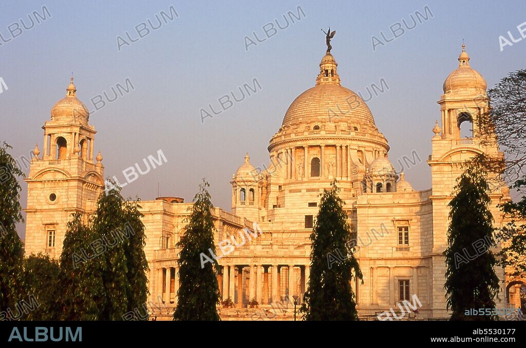 The Victoria Memorial Hall was built between 1906 and 1921 and is dedicated to the memory of Queen Victoria (1819–1901), Empress of India. The memorial was built in an Indo-Saracenic revivalist style and the architect was William Emerson (1843 - 1924). The tax records of Mughal Emperor Akbar (1584–1598) as well as the work of a 15th century Bengali poet, Bipradaas, both mention a settlement named Kalikata (thought to mean ‘Steps of Kali’ for the Hindu goddess Kali) from which the name Calcutta is believed to derive. In 1690 Job Charnock, an agent of the East India Company, founded the first modern settlement in this location. In 1698 the company purchased the three villages of Sutanuti, Kolikata and Gobindapur. In 1727 the Calcutta Municipal Corporation was formed and the city’s first mayor was appointed. In 1756 the Nawab of Bengal, Siraj ud-Daulah, seized Calcutta and renamed the city Alinagar. He lost control of the city within a year and Calcutta was transferred back to British control. In 1772 Calcutta became the capital of British India on the orders of Governor Warren Hastings. In 1912 the capital was transferred to New Delhi while Calcutta remained the capital of Bengal. Since independence and partition it has remained the capital and chief city of Indian West Bengal.