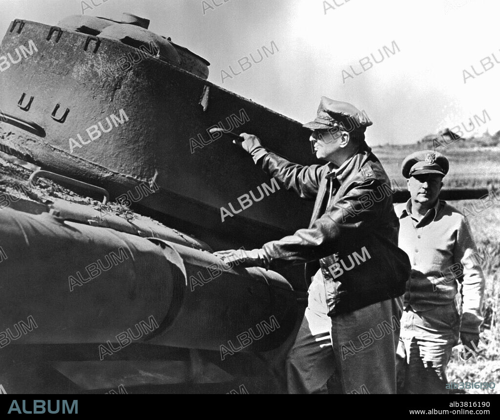 Caption: "General MacArthur, Commanding General for the unified UN forces Aiding the Republic of Korea to repel the North Korean Communists, and a staff officer (right) inspecting a Communist tank, destroyed during the recent UN landings at Inchon." Douglas MacArthur (January 26, 1880 - April 5, 1964) was an American Army General. During WWI he was nominated for a Medal of Honor, awarded the Distinguished Service Cross twice and the Silver Star seven times. He retired from the US Army in 1937 to become Military Advisor to the Commonwealth Government of the Philippines. He was recalled to active duty in 1941. For his defense of the Philippines, MacArthur was awarded the Medal of Honor. He officially accepted Japan's surrender on September 2, 1945, and oversaw the occupation of Japan from 1945-51. He led the UN Command in the Korean War until he was removed by President Truman on April 11, 1951. The relief of MacArthur by the unpopular Truman led to a constitutional crisis, and a storm of public controversy. Douglas and Jean MacArthur spent their last years together in the penthouse of the Waldorf Towers, in NYC. Her died in 1964, at the age of 84, of biliary cirrhosis.