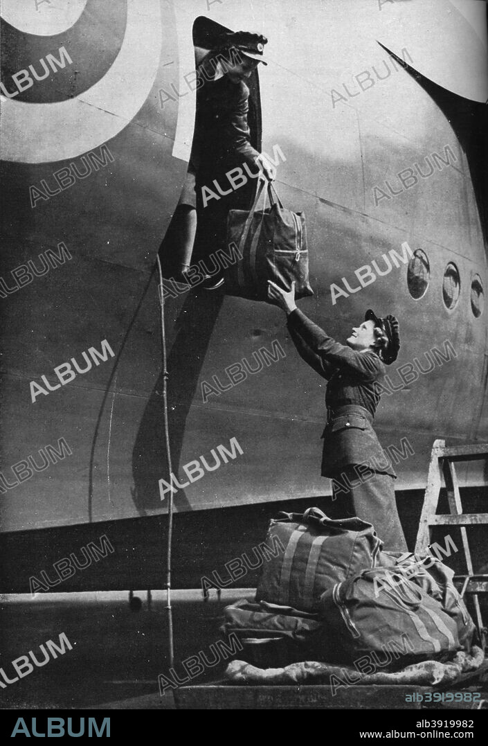 Members of the WAAF serving in Coastal Command, c1940 (1943). Two members of the Women's Auxiliary Air Force putting their air crew's equipment aboard a plane during World War II. From Coastal Command. [His Majesty's Stationery Office, London, 1943].