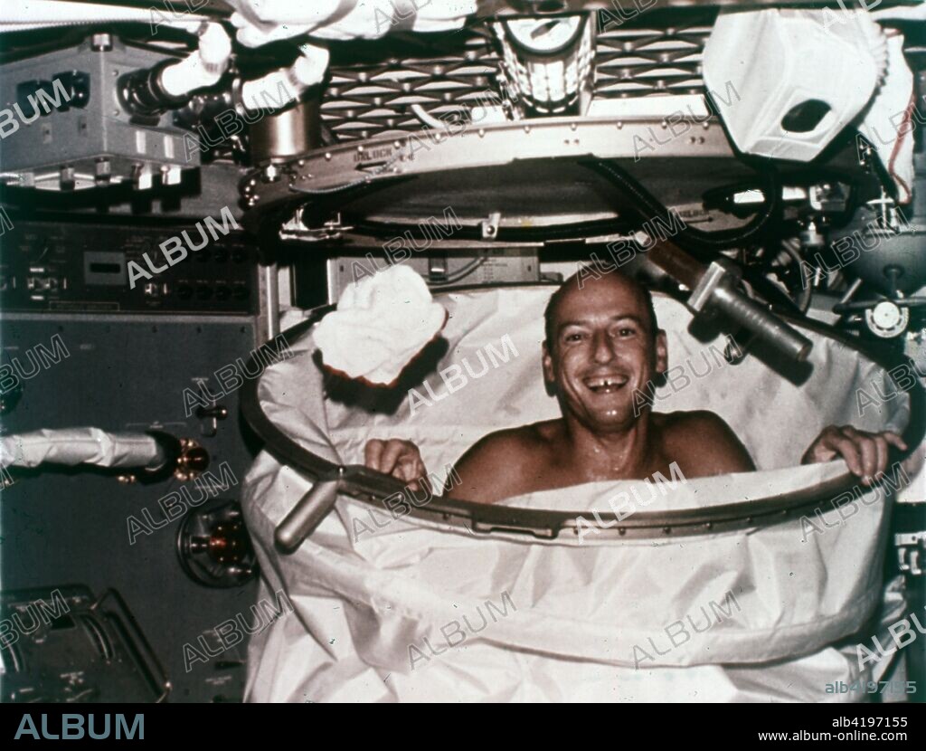 Conrad in shower facility aboard Skylab 2, 1973. Skylab 2 commander Pete Conrad takes a shower in zero gravity. The Skylab space station, first launched in May 1973, and was occupied in succession by three teams of three crewmembers. These crews orbited the Earth and performed nearly 300 experiments.