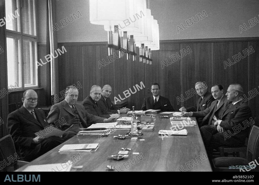 ERICH LESSING. Krupp industries: Alfried Krupp was sentenced to a prison term by an Allied Court for the family's part in the Nazi war-effort. After his release, rebuilding began. Board meeting of the Krupp industries, presiding is Berthold Beitz, Krupp's General Manager. Essen,1957.