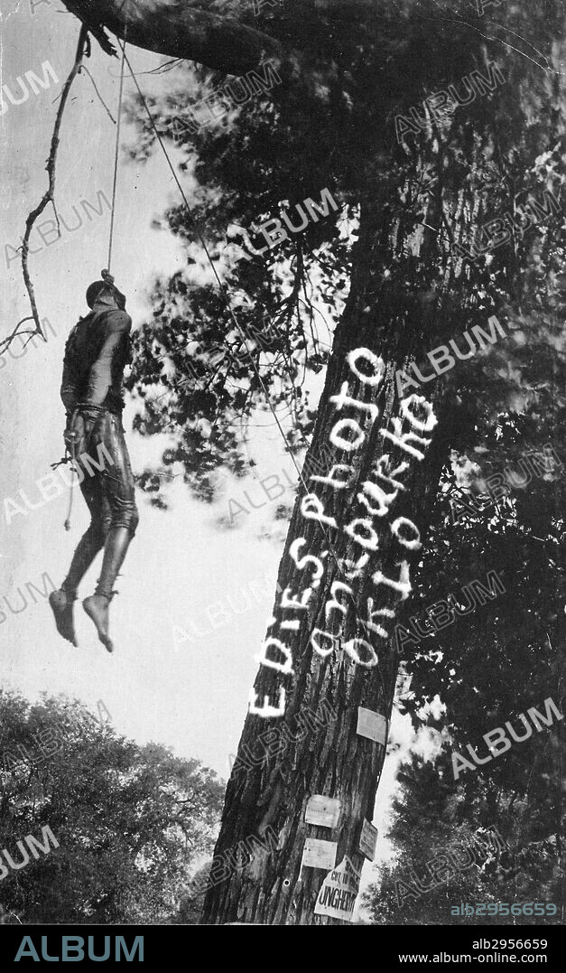 Photograph of the Lynching of Bennie Simmons, soaked in coal oil before being set on fire. Anadarko, Oklahoma. Dated 1913.