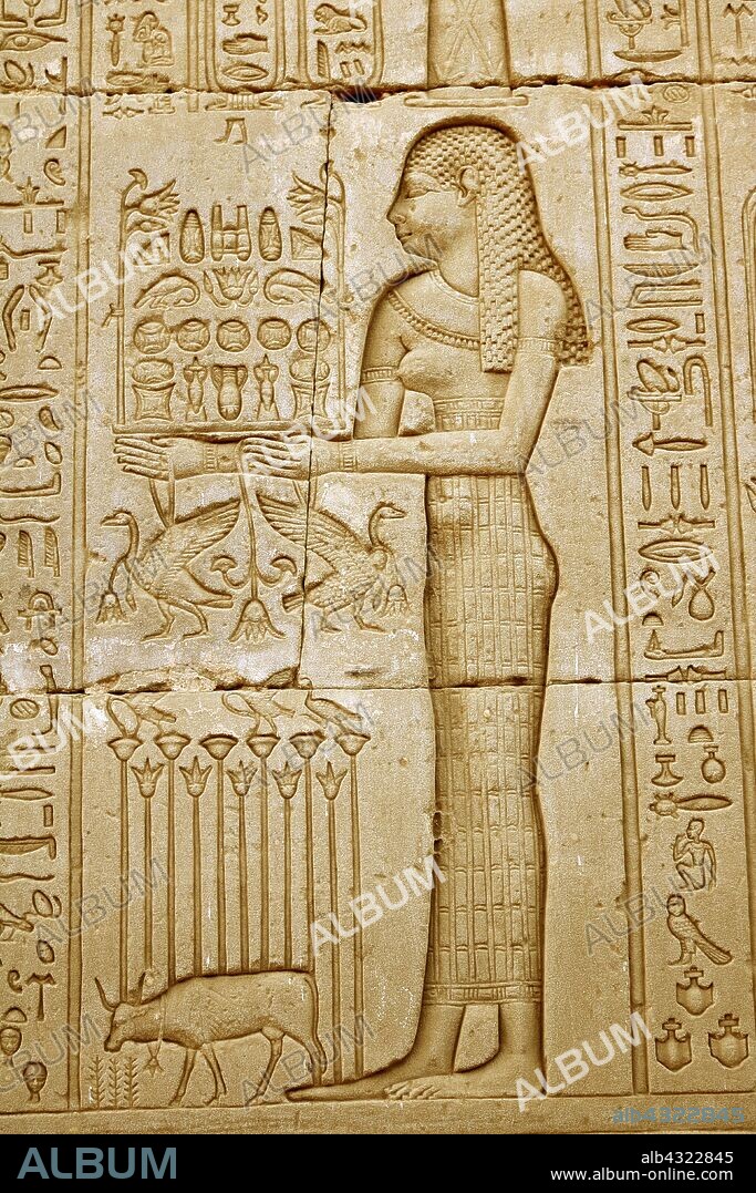 Carving at the Temple of Hathor, Dendera, Egypt. The Goddess Neth, Neith (Nit, Net, or Neit), an early goddess in the Egyptian pantheon, said to be the first and the prime creator.