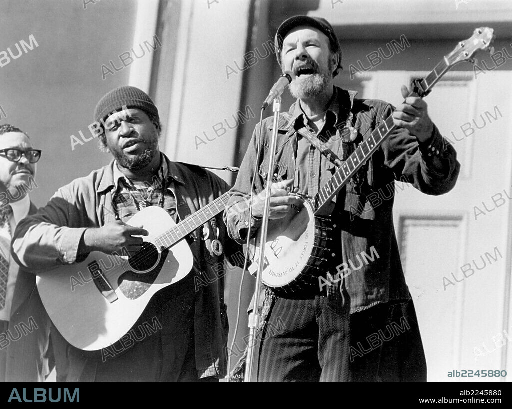 Jan 28, 2014 - FILE - PETER 'PETE' SEEGER was an American folk singer or as he called himself a 'River' singer. As a member of The Weavers he was blacklisted during the McCarthy Era. In the 1960s, he re-emerged on the public scene as a prominent singer of protest music in support of international disarmament, civil rights, counterculture and environmental causes. Pictured - Oct. 11, 1975 - Pete Seeger performs at a protest in New York. 05/04/2006
