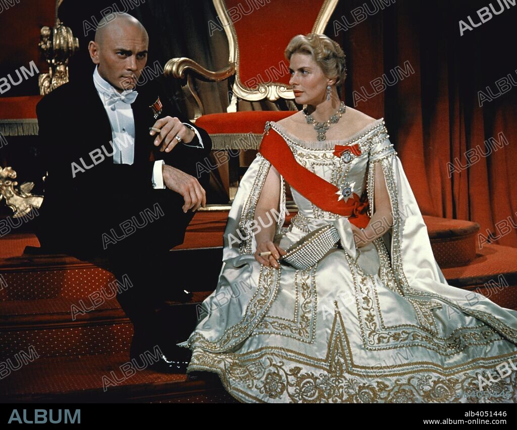Yul Brynner and Ingrid Bergman in the film 'Anastasia', 1956. Directed by Anatole Litvak, the film tells the story of a young woman, played by Ingrid Bergman (1915-1982), who is persuaded by a group of Russian emigres, the leader of whom is played by Yul Brynner (1920-1985), into passing herself off as the Grand Duchess Anastasia, daughter of the murdered Tsar Nicholas II.