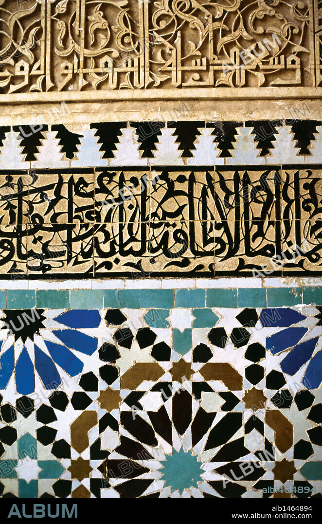 Mosaic with arab and kufic caligraphy (top) on a wall of the Madrasa. Fes. Morocco.