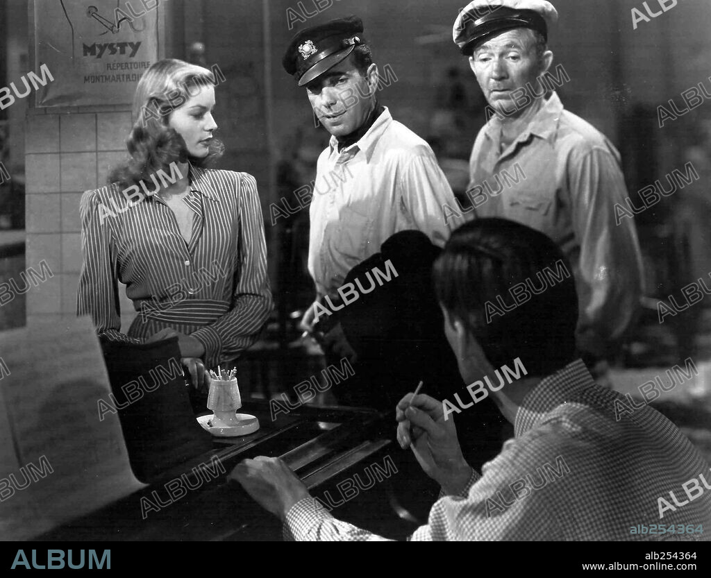 HUMPHREY BOGART, LAUREN BACALL and WALTER BRENNAN in TO HAVE AND HAVE NOT, 1944, directed by HOWARD HAWKS. Copyright WARNER BROTHERS.