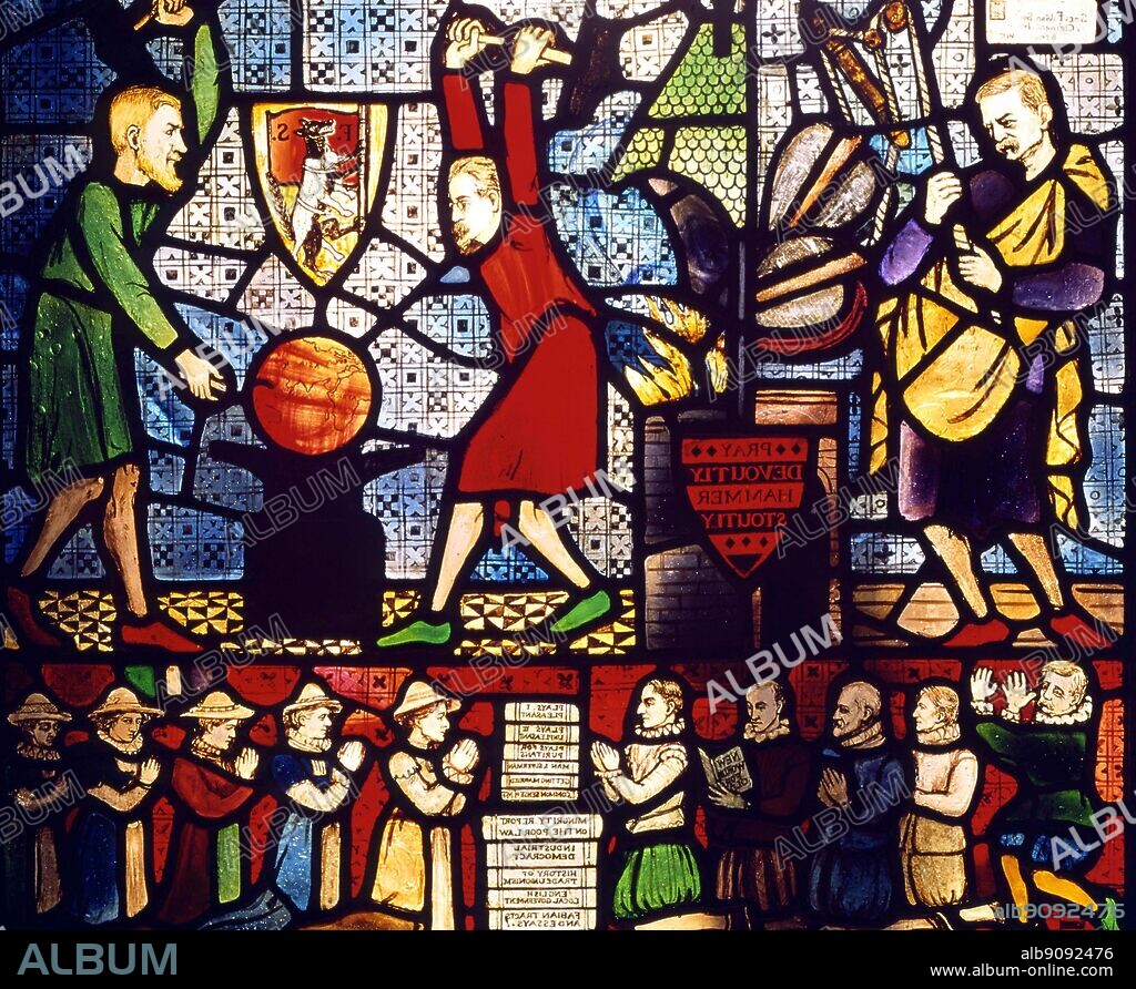 The Fabian Window at the Beatrice Webb House Leith Hill Surrey. The large figures ( Edward Pease Secretary to the Fabian Society, Sidney Webb and George Bernard Shaw. the kneeling figure, all Fabians include H G Wells thumbing his nose at the left, and Caroline Townshend who made the window. the books composing the altar include works by Shaw and the Webbs and Fabian Tracts. The window was commissioned by Shaw in 1910.