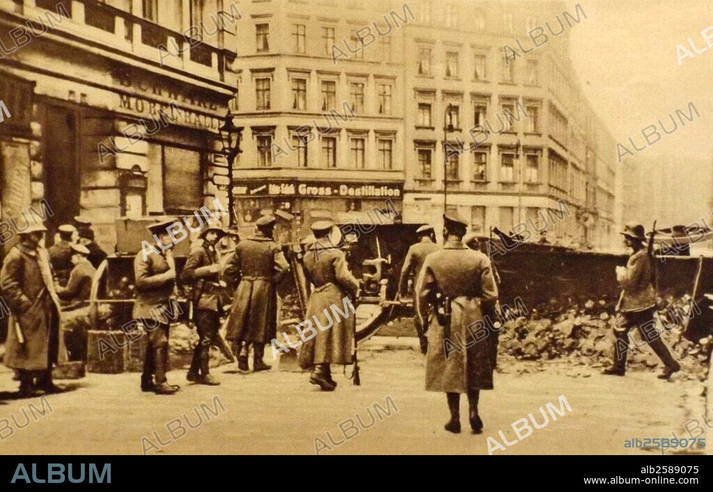 Government troops move against spartacist positions in Berlin. 1919.  The Spartacist uprising (German: Spartakusaufstand), was a general strike and the armed battle in Germany from January 4 to January 15, 1919. Its suppression marked the end of the German Revolution. The name "Spartacist uprising" is generally used for the event even though neither the 'Spartacist League' nor the Communist Party of Germany led this uprising; each participated only after popular resistance had begun..