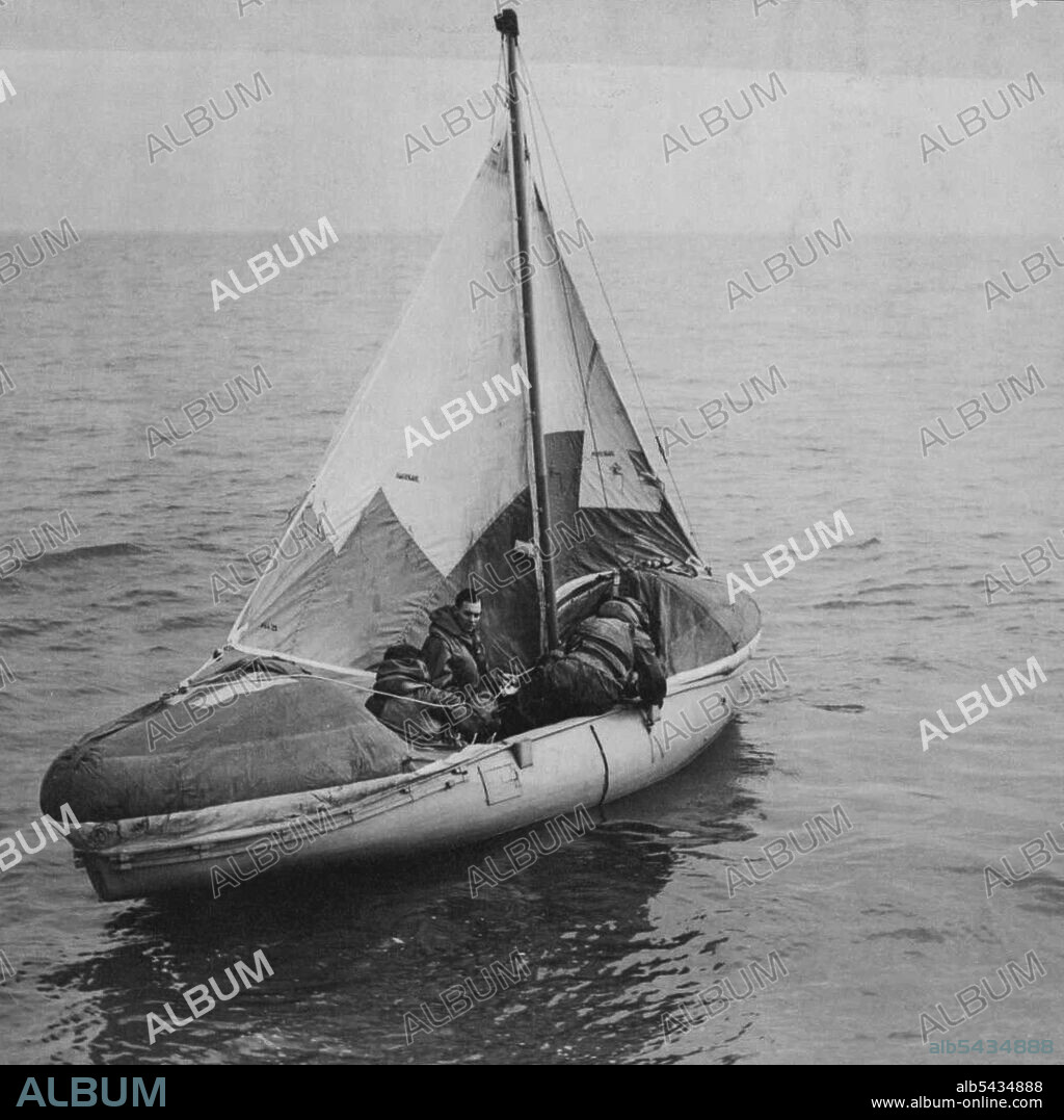 Rescue By Airborne Lifeboat -- Rescue from the sea by lifeboats dropped from aircraft is now a feature of the work of R.A.F. Coastal Command Air-Sea Rescue Service lifeboats, fitted with two-stroke engines,  a height of 700ft, sails set and engines ready, a rescued crew sails for home. March 2, 1945. (Photo by Topical Press).