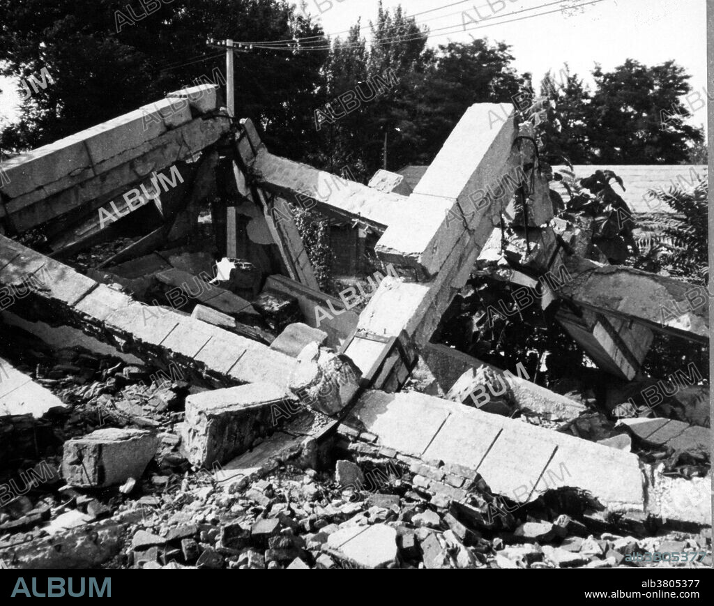 Tangshan, China, Earthquake July 27 UTC (local time July 28), 1976. Damage to the library of the Hebei Mine Smelting Institute. This building is being preserved as a record of what happened in the 1976 earthquake. This earthquake occurred in the northeastern part of China, near the coast. The epicenter was centered about 140 kilometers southeast of Beijing, in the vicinity of Tangshan. The first earthquake, magnitude 7.5, was followed by a major aftershock 15 hours later. According to official sources, the two earthquakes killed 242,769 people, although some estimates of the death toll are as high as 655,000. Over 799,000 people were injured. Aftershocks in the 5.0-5.5 range continued after the main shock. Damage extended as far as Beijing.