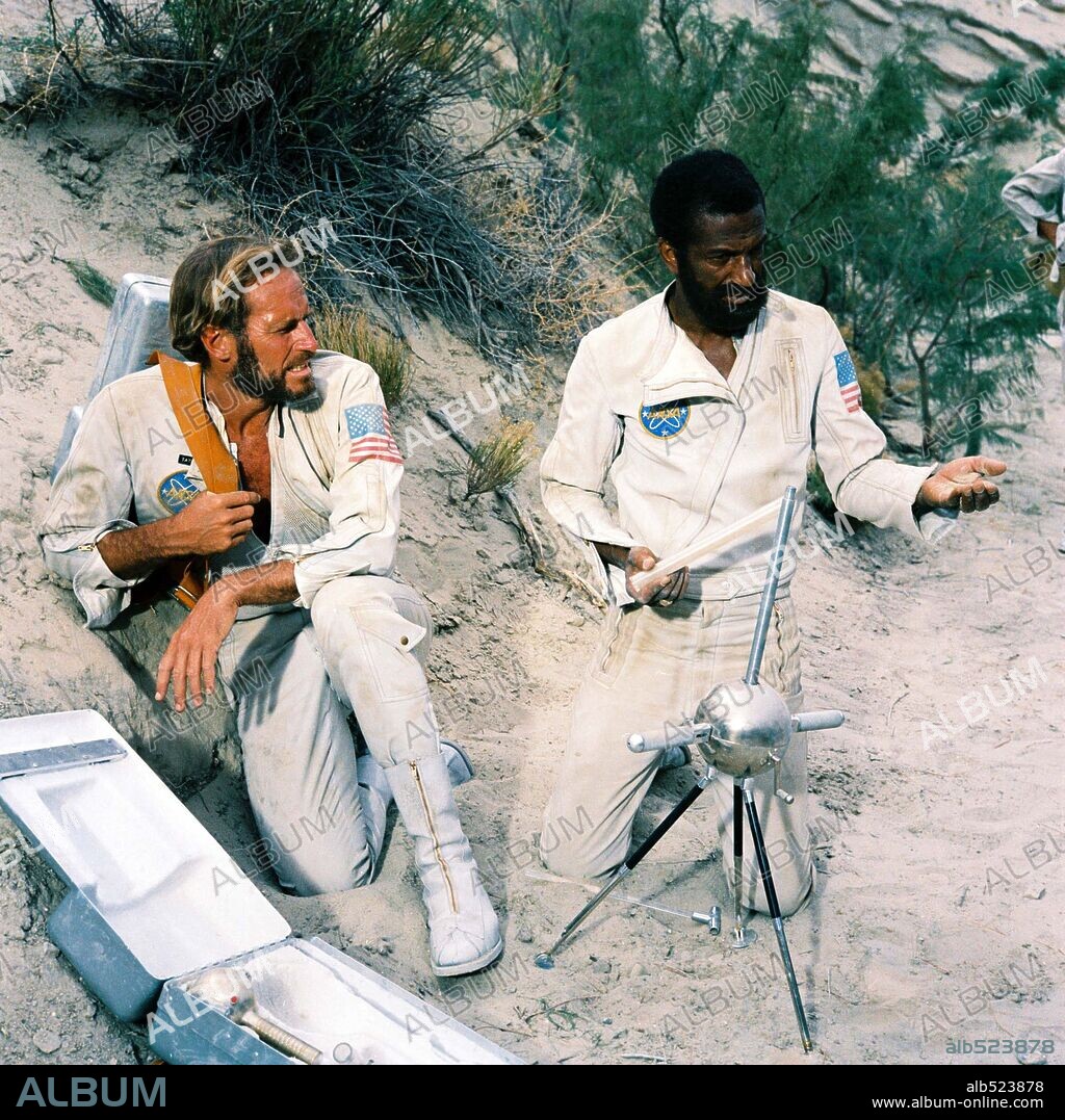 CHARLTON HESTON and JEFF BURTON in PLANET OF THE APES, 1968, directed by FRANKLIN J. SCHAFFNER. Copyright 20TH CENTURY FOX.