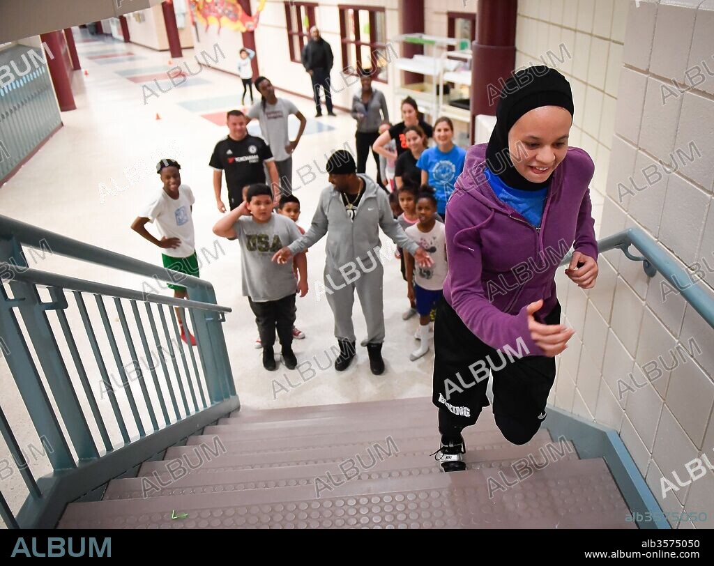 February 7, 2017 - Minneapolis, Minnesota, U.S. - AMAIYA ZAFAR races up the stairs at Richard Green Elementary during an after-school boxing program. She helped lead the class with ADONIS FRAZIER, a boxing coach from the nearby Circle of Discipline gym. (Credit Image: © Aaron Lavinsky/Minneapolis Star Tribune/zReportage.com via ZUMA Wire). 07/02/2017
