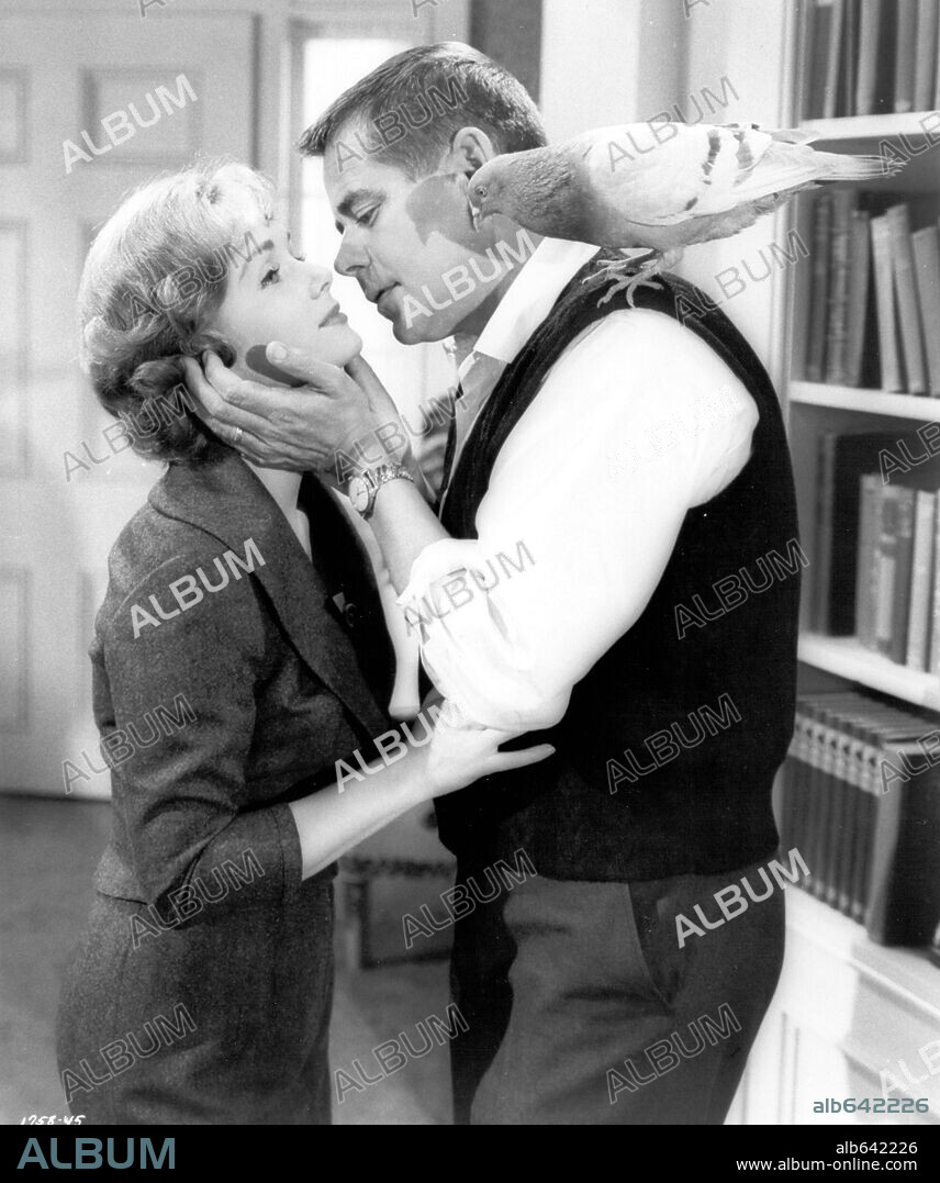 DEBBIE REYNOLDS and GLENN FORD in THE GAZEBO, 1959, directed by GEORGE MARSHALL. Copyright METRO GOLDWYN MAYER.