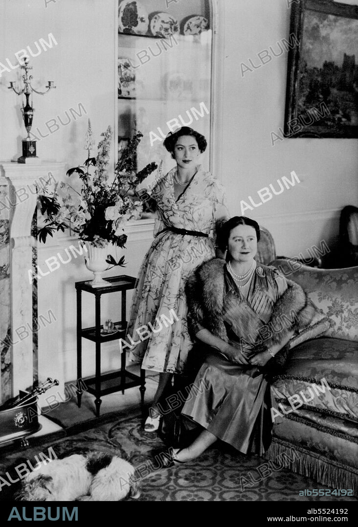 Princess Margaret Birthday Portrait --This portrait of Princess Margaret and her mother, Queen Elizabeth the Queen mother, was made in the morning room at Clarence house, London, especially for the princess's 24th Birthday Anniversary of August 21.Princess Margaret wears a dress of white organza patterend with violet colour flowers. The Queen Mother wears a dress of Blue-Grey silk, with a grey fox fur.Pet Sealyham puppy, "Pippin."The Photographer was Cecil Beaton.Princess Margaret, sister of Queen Elizabeth, lives at Clarence house with the Queen Mother. Clarence house is near Buckingham Palace. August 18, 1954. (Photo by Associated Press Photo).