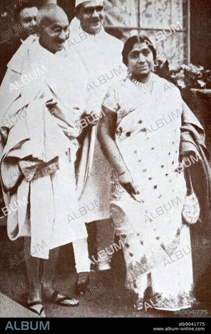Mahatma Gandhi With Mahadev Desai and Sarojini Naidu on their way to Buckingham Palace, London, to meet the King, 1931. Mohandas Gandhi (1869 1948) was the preeminent leader of the Indian independence movement in British-ruled India. Mahadev Desai (1892 1942) was an Indian independence activist and writer best remembered as Mahatma Gandhi's personal secretary. Sarojini Naidu (born as Sarojini Chattopadhyay) also known by the sobriquet as The Nightingale of India and was a poet. Naidu served as the first governor of the United Provinces of Agra and Oudh from 1947 to 1949. She was the second woman to become the president of the Indian National Congress in 1925.