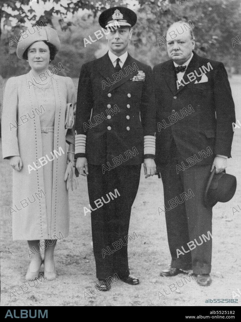 Nazi Raiders Bomb Buckingham Palace -- The King and Queen with the Prime Minister photographed in the grounds of Buckingham palace, after inspecting the damage *****. November 11, 1940. (Photo by Keystone Press Agency Ltd.).