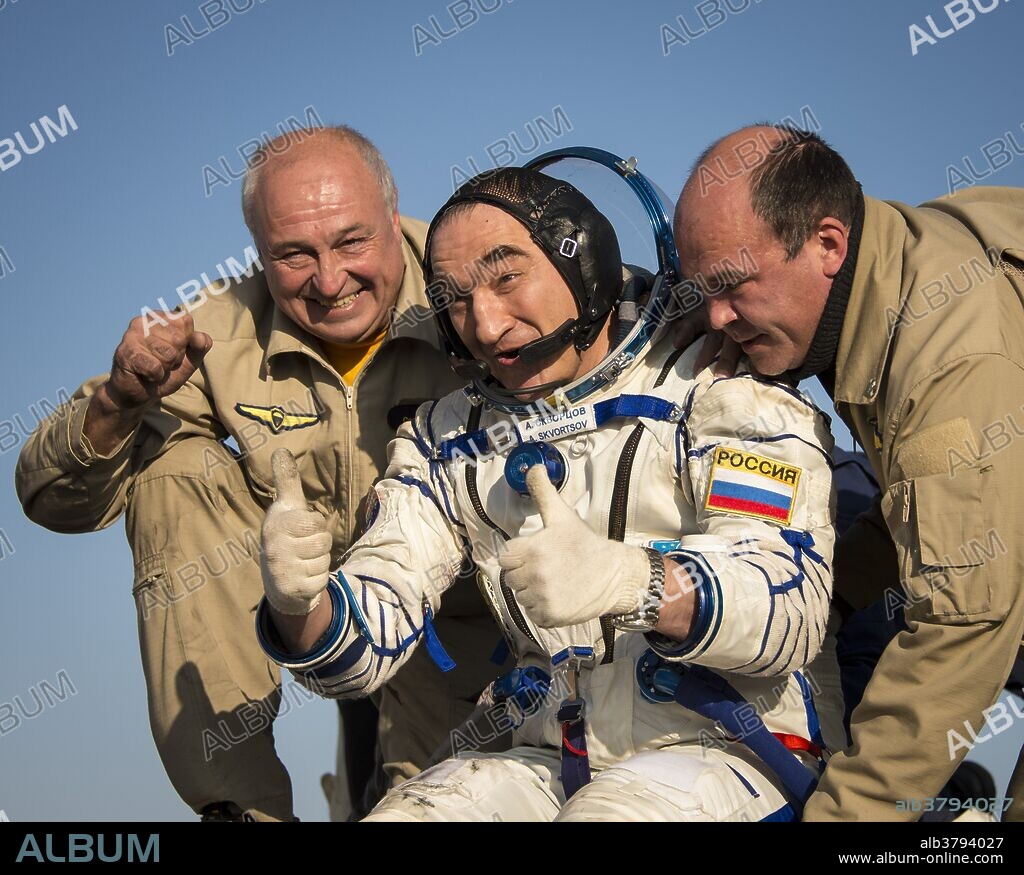 Expedition 40 Flight Engineer Alexander Skvortsov of the Russian Federal Space Agency (Roscosmos) gives a thumbs up as he is helped out of the Soyuz Capsule just minutes after he and Flight Engineer Oleg Artemyev of Roscosmos, and Expedition 40 Commander Steve Swanson of NASA, landed in their Soyuz TMA-12M capsule in a remote area near the town of Zhezkazgan, Kazakhstan on Thursday, Sept. 11, 2014. Swanson, Skvortsov and Artemyev returned to Earth after more than five months onboard the International Space Station where they served as members of the Expedition 39 and 40 crews.