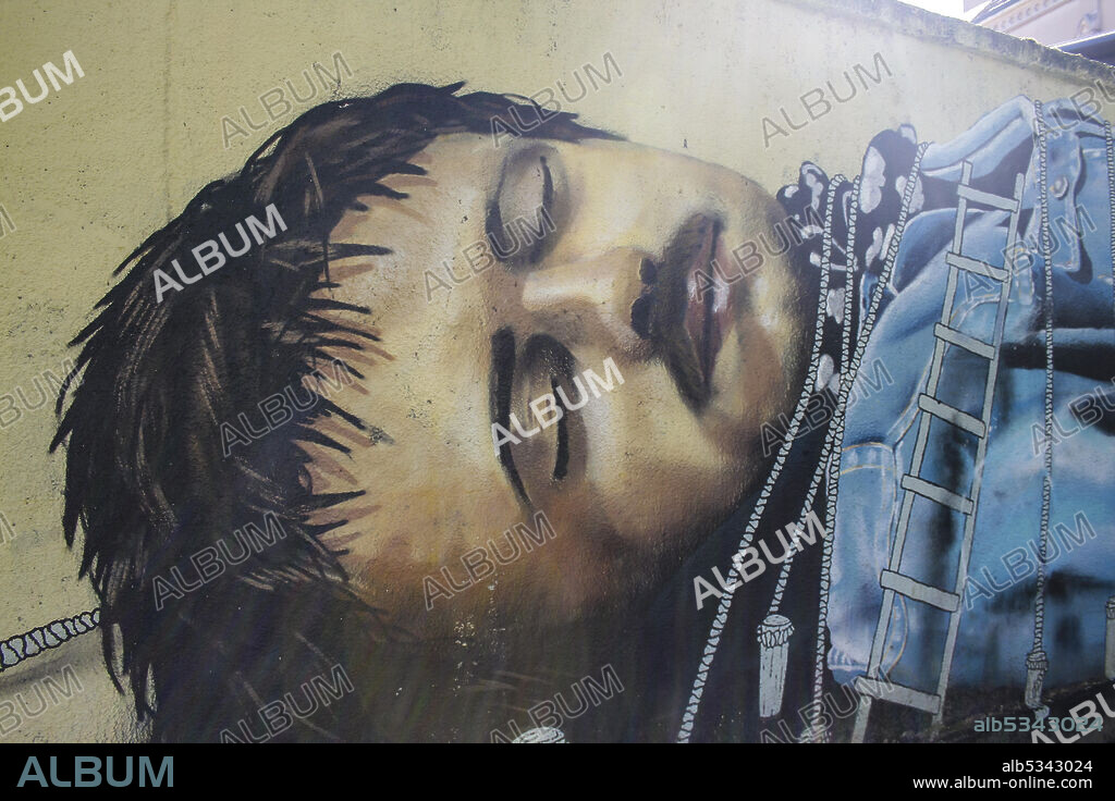 Zagreb, Croatia, Republika Hrvatska, Europe. The park of Bishop Stephen II (Perivoj Biskupa Stjepana II). A mural that portrays lying Gulliver, tied by the Lilliputians!. The authors are the artists from the creative collective Pimp my Pump, late 19th century. Detail of Gulliver's head.