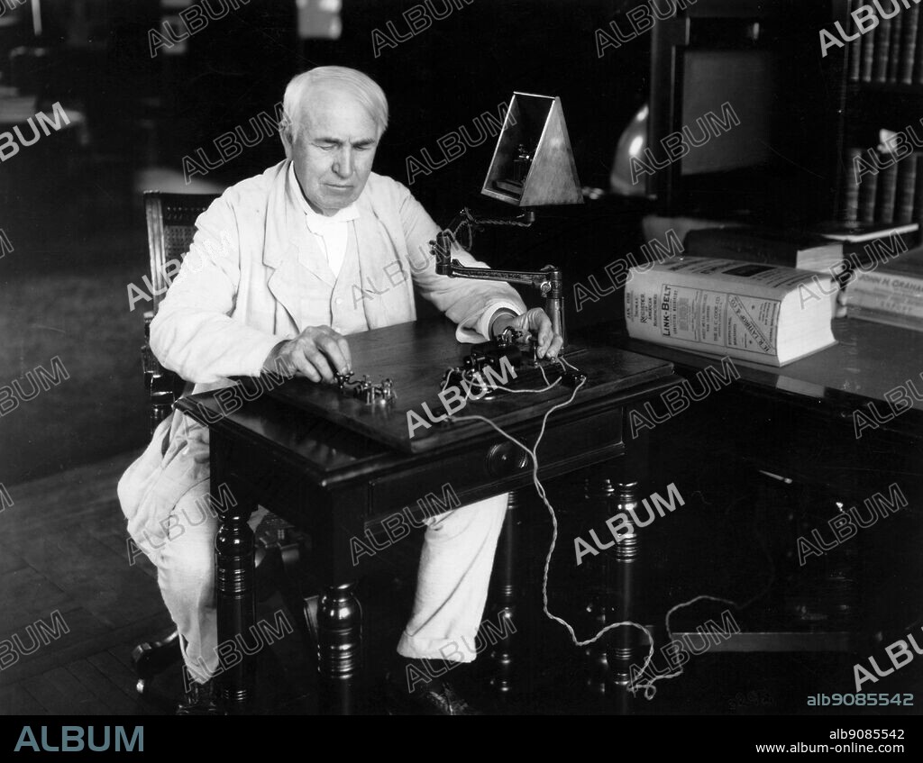Edison seated at Telegraph key 1920. 28th July 1920. Edison National Historic Site Orange New Jersey. Edison, Thomas Alva (the Wizard of Menlo Park) US inventor; opened research laboratory in Menlo Park, New Jersey 1876 (moved to West Orange, New Jersey 1887); invented phonograph (1st demonstrated 1877); invented incandescent electric light 1879; invented kinetograph camera and kinetoscope motion-picture viewer (patented 1891) _1847-1931.