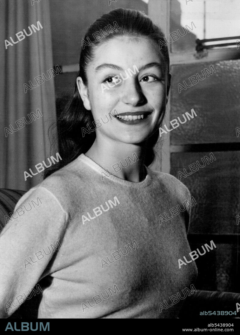 Starlet From France -- Young Parisier dark-haired Anouk Aimee wearing a very pleasing smile. Latest recruit to the J. Arthur Race Organisation is 16-years-old Anouk Aimee, of Paris. Anouk was at school in London, and therefore speaks English,but before she starts work on her new film, "Golden Salamander" she will have a special governess to improve her accent. February 01, 1949. (Photo by Evening Newspapers).;Starlet From France -- Young Parisier dark-haired Anouk Aimee wearing a very pleasing.