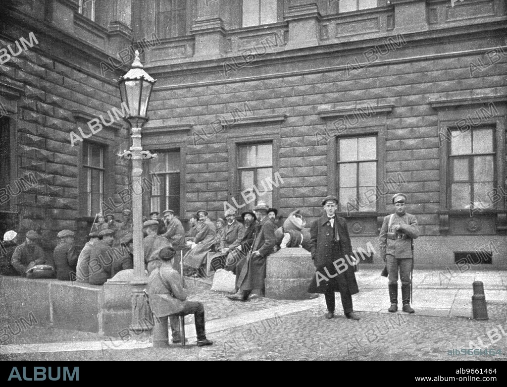 ROBERT VAUCHER. ''La terreur Rouge; La "Bourgeoisie" traquee; groupe d'otages arretes par les Rouges devant le Palais Marie, a Petrograd, le 26 septembre 1918', 1918. From "L'Album de la Guerre 1914-1919, Volume 2" [L'Illustration, Paris, 1924].