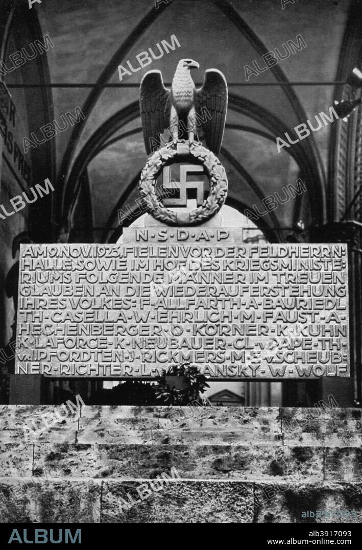 Monument on the Munich Feldherrnhalle, Germany, 1936. Monument  commemorating the failed Nazi Beer Hall Putsch of 9 November 1923. A print from Adolf Hitler. Bilder aus dem Leben des Führers, Hamburg: Cigaretten/Bilderdienst Hamburg/Bahrenfeld, 1936.