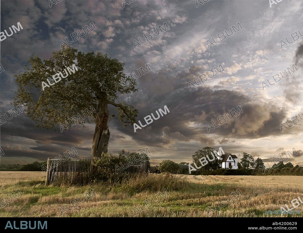 Royal Oak and Boscobel House, Shropshire, 2008. View with a dramatic sky. Boscobel House, a 17th century former hunting lodge, is famous as the place where Charles II hid in a nearby oak tree following his defeat at the Battle of Worcester in 1651.