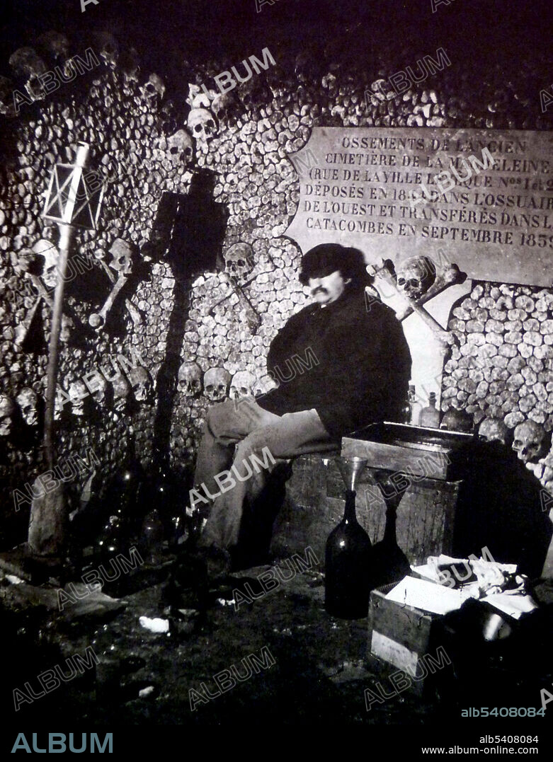 By the end of the 18th century, overcrowded cemeteries in Paris had become a medical problem and city officials began to use the catacombs beneath the streets as a massive burial ground. They were opened to the public and artists soon followed, generating a new interest in the macabre. Although the prefect of Paris officially closed the catacombs to the public in 1830, lovers of the bizarre periodically gained access to the subterranean vaults. Known primarily for his portraiture, Nadar made this photograph of the ghoulish décor with an artificial light of his own design, an early arc lamp known as a Serrin Regulator. Nadar, 1861 (cropped and cleaned).