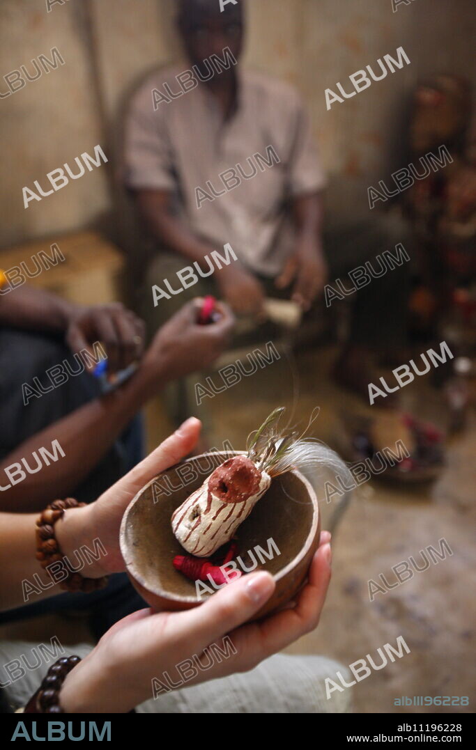Voodoo ritual with a tourist, Akodessewa fetish market, Lome, Togo, West Africa, Africa.