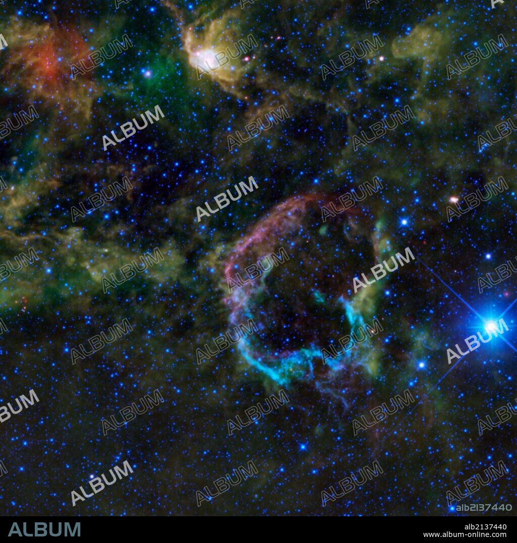 This oddly colorful nebula is the supernova remnant IC 443 as seen by NASA's WISE. Also known as the Jellyfish nebula. (Photo by: Universal History Archive/UIG via Getty Images).