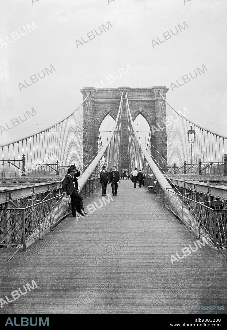 Brooklyn Bridge, Looking East, New York City Side, Daniel Berry Austin, American, born 1863, active 1899-1909, Glass plate negative, July 7, 1899, 5 x 7 in., 12.7 x 17.8 cm, architecture, archival photograph, Brooklyn Bridge, cityscape, civil engineering, documentary photography, early photojournalism, East River, historic Brooklyn, historic New York, landmark, municipal, New York City, old Brooklyn, old New York, pedestrians, skyline, suspension bridge, transportation, urban, vintage photograph.